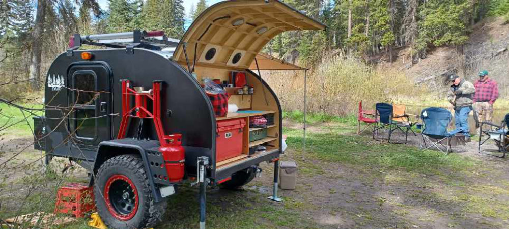 Off Road Teardrop Trailer By Overland Teardrop Trailer Kit. Red and black paint at a campsite